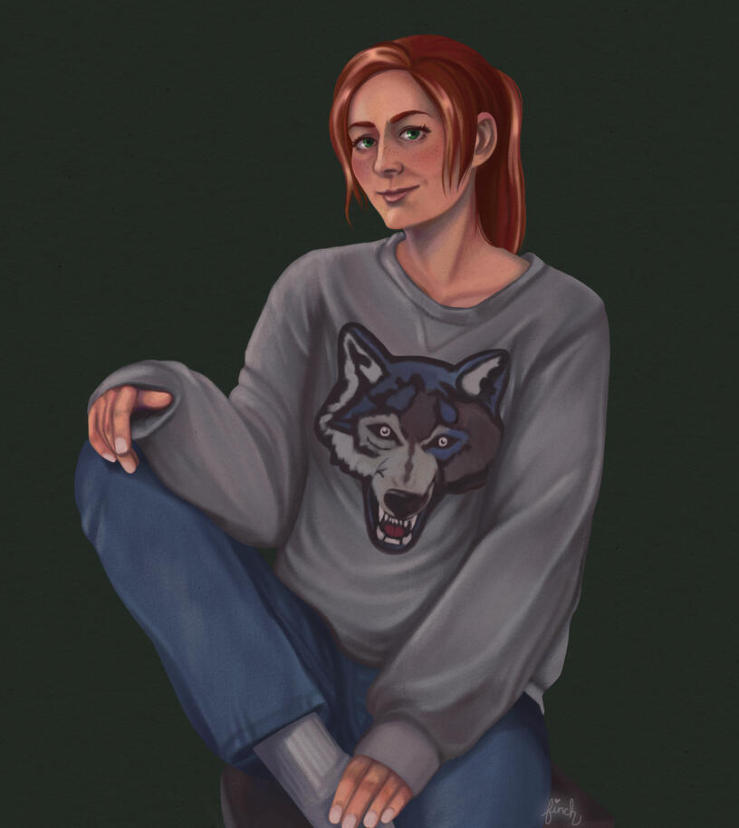 A full color illustration of Hannah Shepard sitting on a stool on a plain green background. She has red hair pulled into a ponytail, green eyes, freckles and a slight smile. She's in jeans & a grey sweater with a big embroidered wolf face.